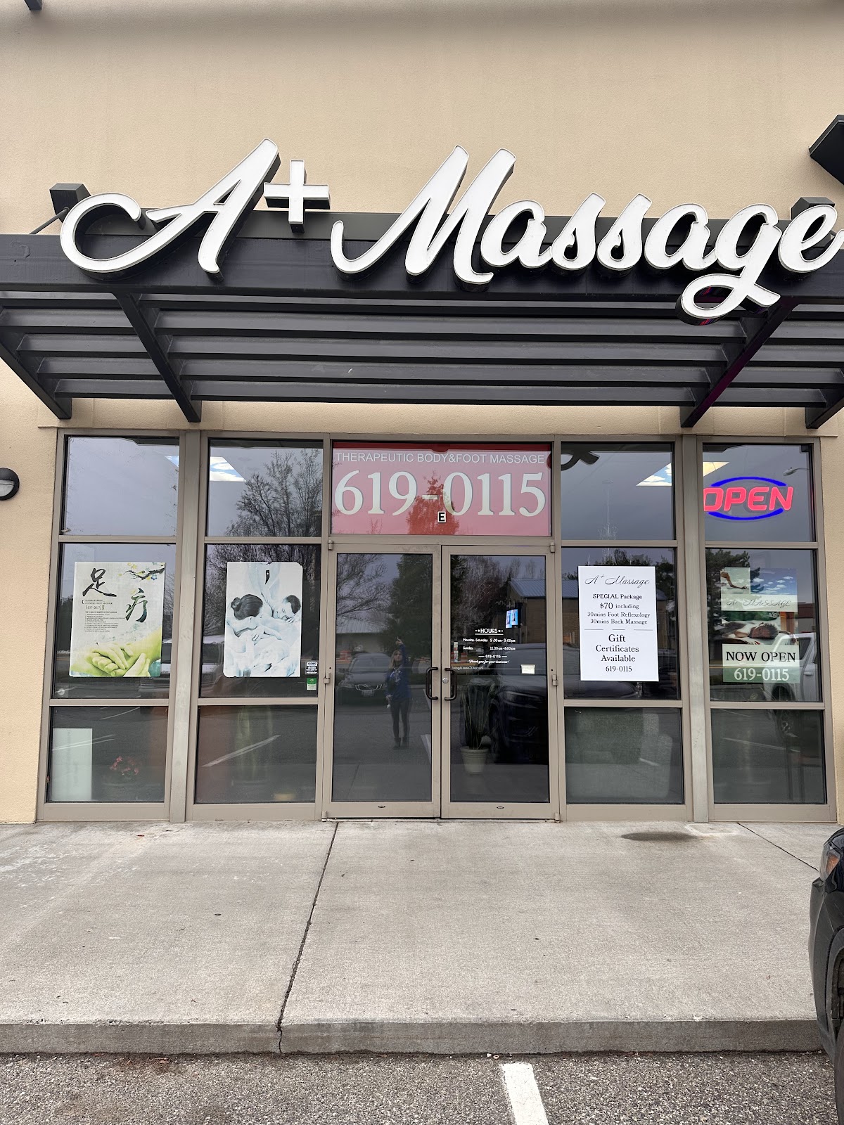 The A+ Massage storefront sign on Columbia Center Blvd in Kennewick