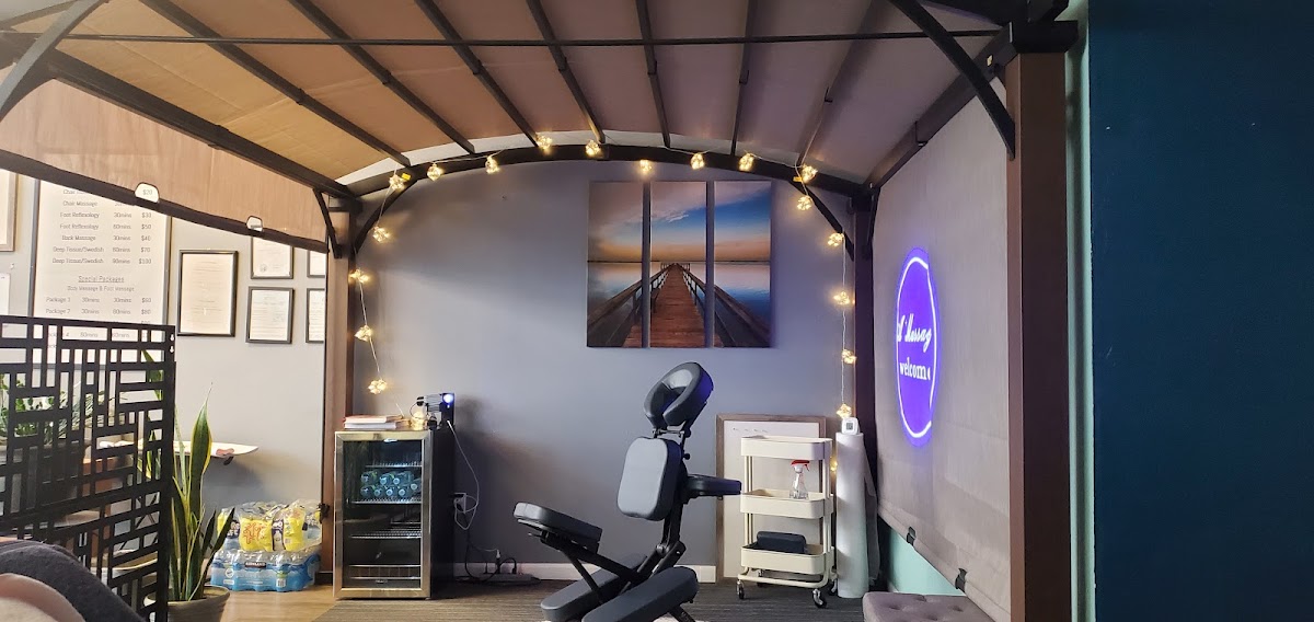 A quiet massage nook lit with warm fairy lights at A+ Massage